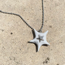 Load image into Gallery viewer, earthy grey clay set with a silver star bead
